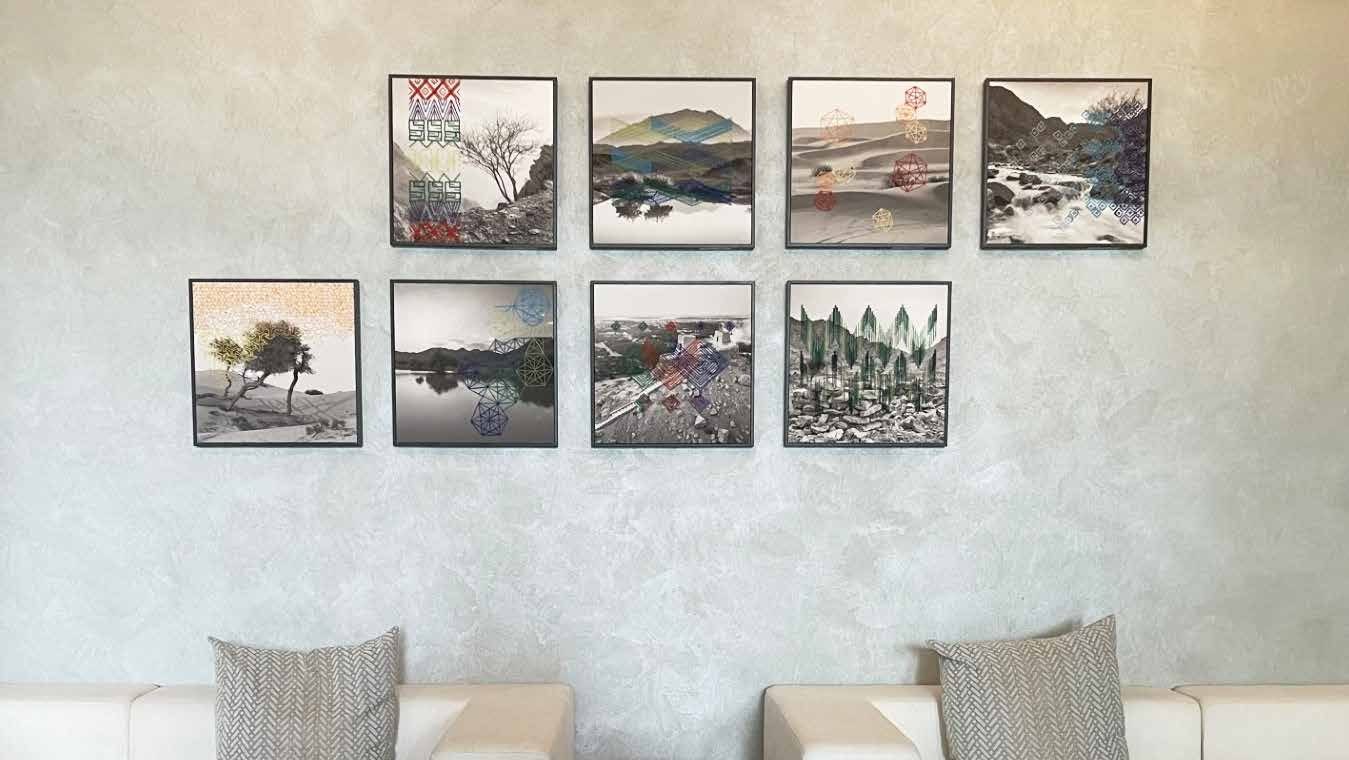 Wall of embroidered landscape artworks at Mövenpick Resort Al Marjan Island